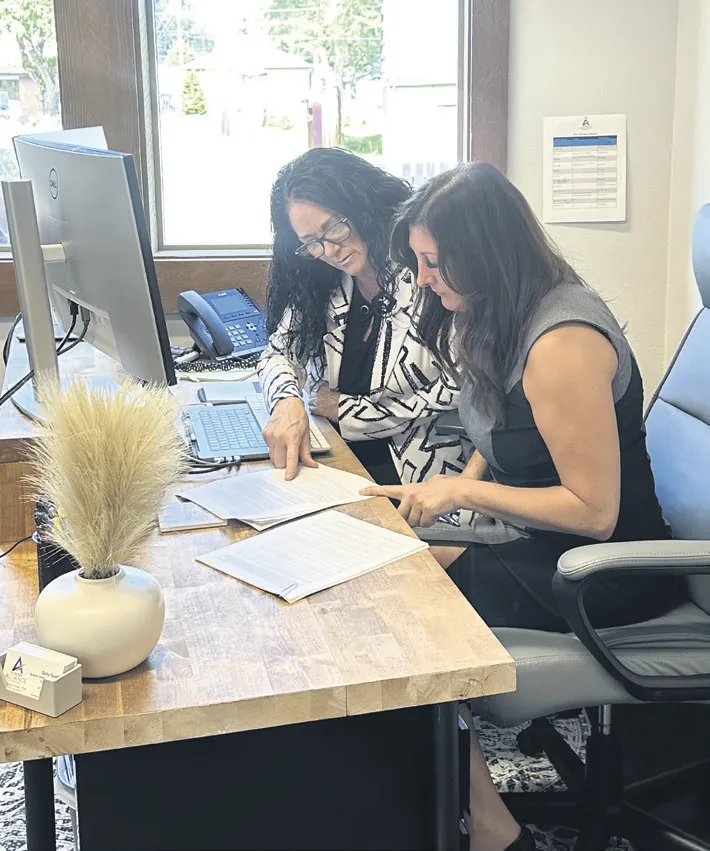 Business Development Center Program Manager Dolly Tardiff, left, and Grant Manager Amy Buzzard, go over business plans at the Alliance office located at 1209 Borthwick Street, Centralia. They are ready to offer a variety of services to assist businesses.