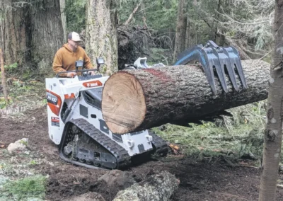 Greenwater Serving photos Greenwater Servicing’s James Henry works timber.